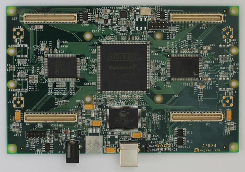 Assembled four-layer ASR34 board: Altera Cyclone FPGA at centre, two high-density board-to-board connectors each side, USB-B and DC jack along the bottom edge.